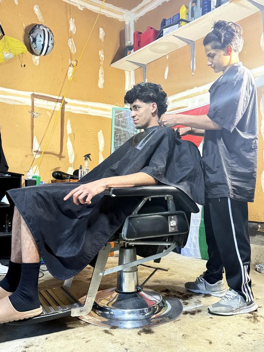 Client receiving a cut in the studio